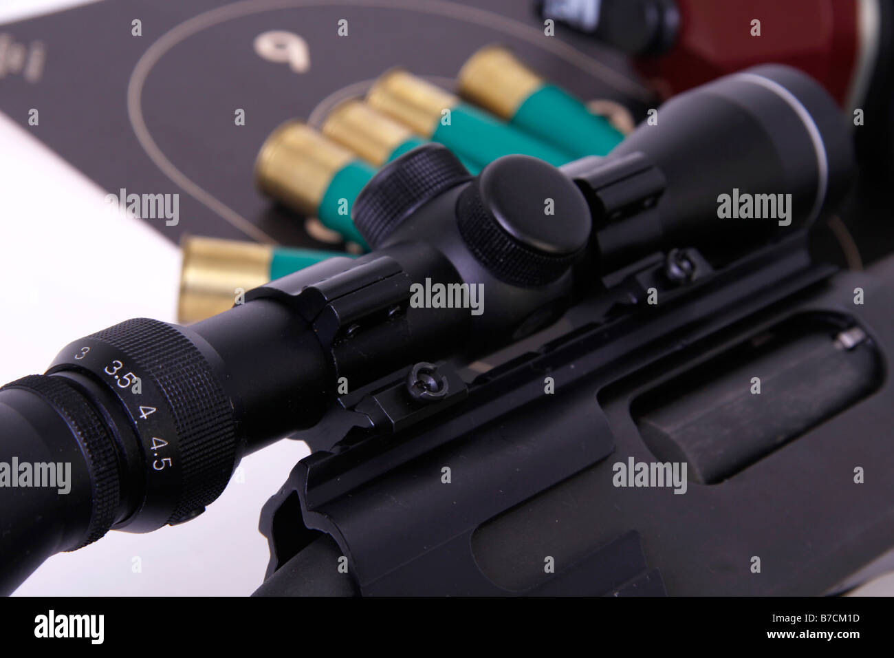 Shutgun with Riflescope shotshell and target Stock Photo - Alamy