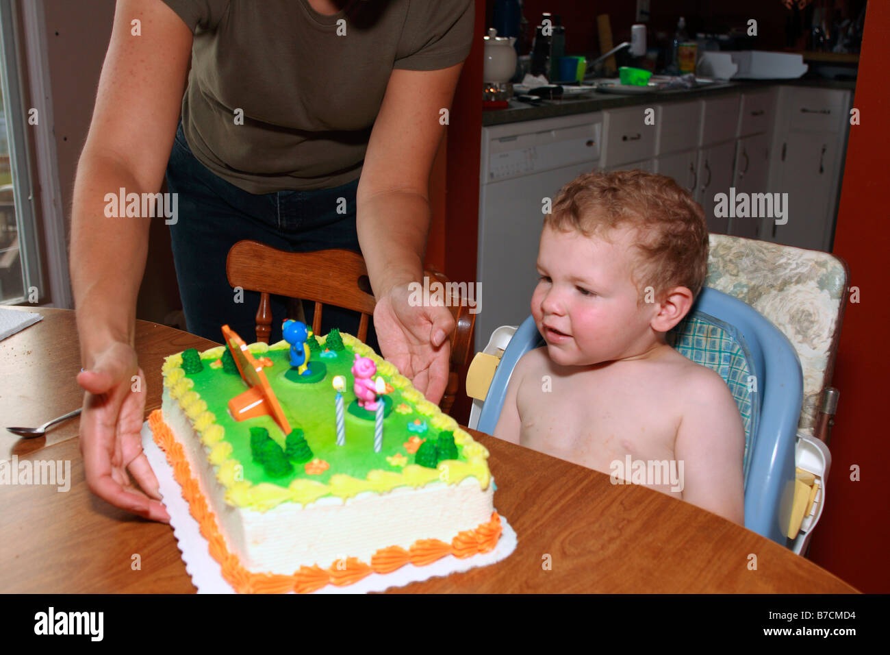 a 2 year old and his birthday cake Stock Photo