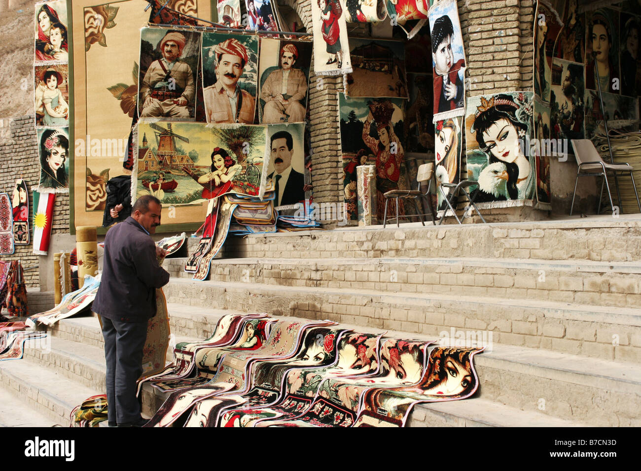 Carpet dealer in Arbil, northern Iraq with portraits of leader Massoud