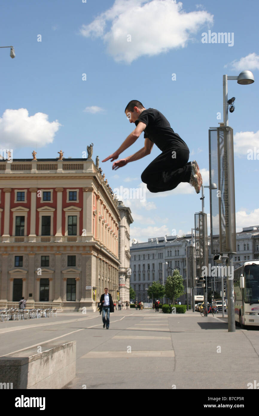 Parkour athlete at a daring jump over obstacles, Austria, Vienna, Donauinsel Stock Photo