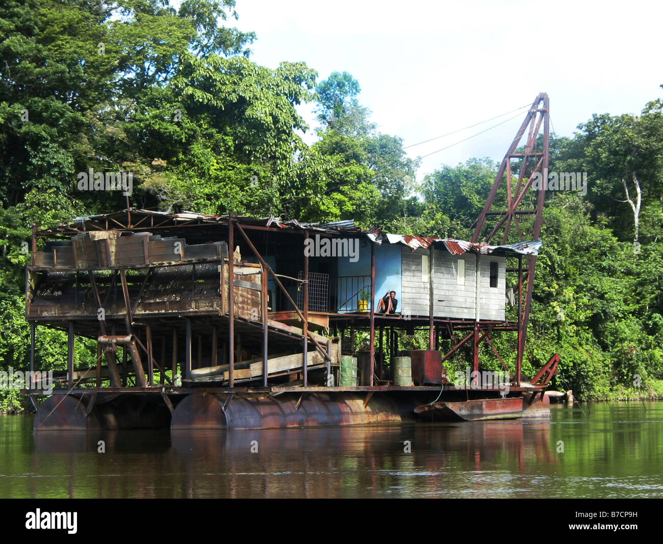 Gold dredging boat in the Marowijne River, Suriname, Marowijne Stock Photo