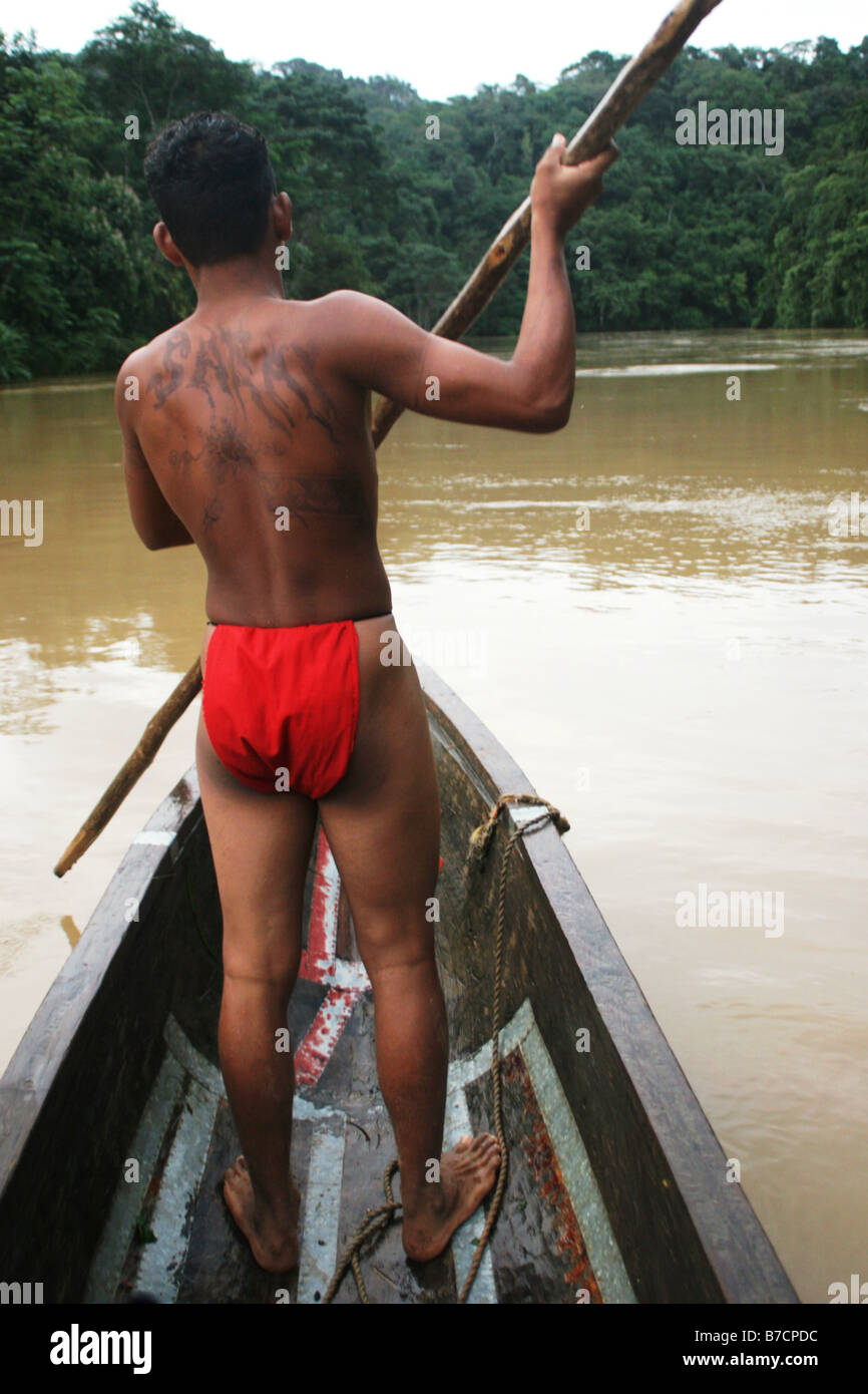 Embera Indian with loincloth in a dugout on Chagres River, Panama, Chagres River Nationalpark, Parar-Paru Stock Photo