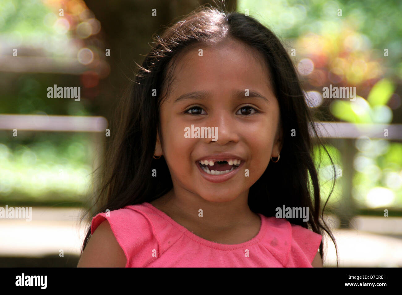 girl with tooth gap in El Castillo, Nicaragua, Rio San Juan Stock Photo