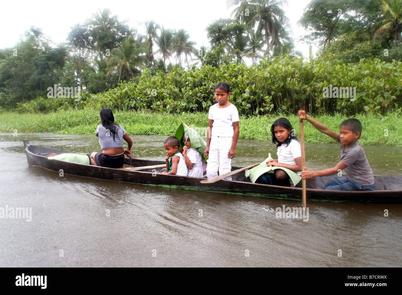 Dugout Raining Children in dugout canoes hi-res stock photography and images - Alamy