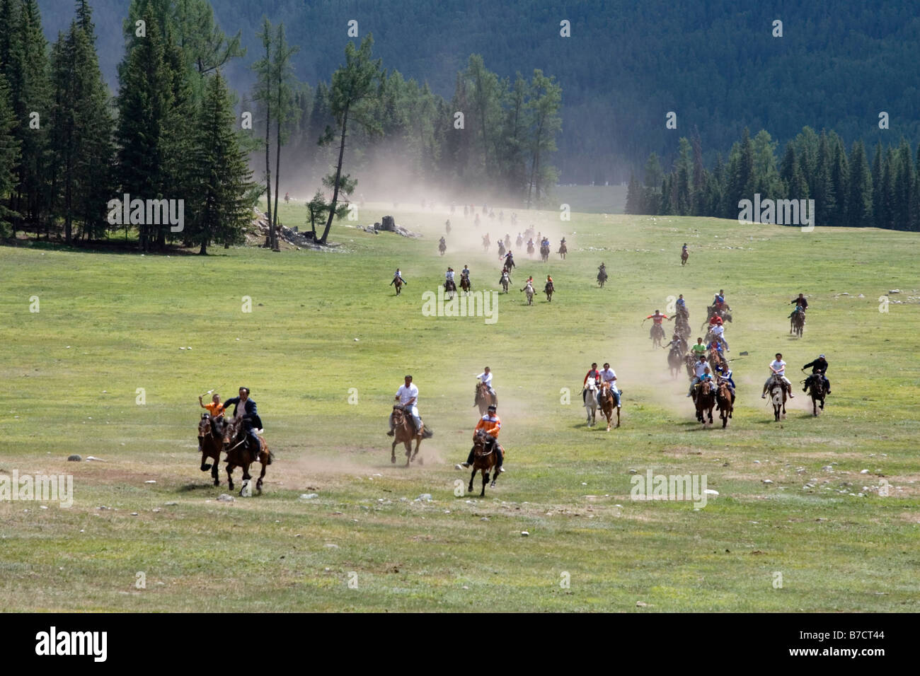 Horse racing during the Mongolian annual competition called Ao Bao Jie. Stock Photo