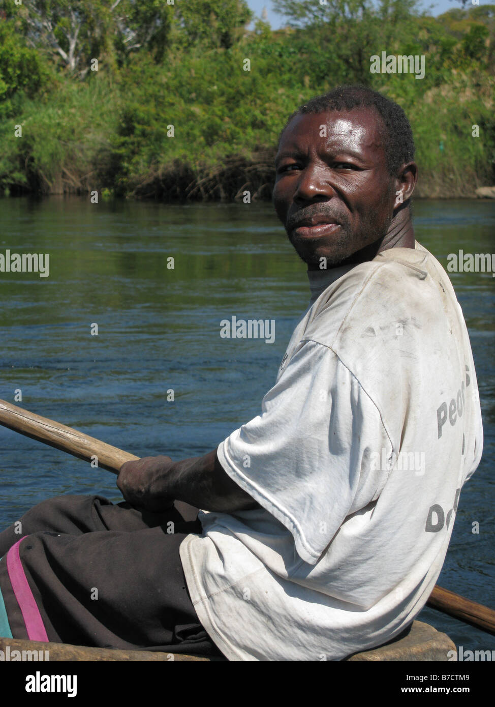Bemba fisherman in dugout canoe on Luapula river close to Mambilima Falls Democratic Republic of Congo Stock Photo