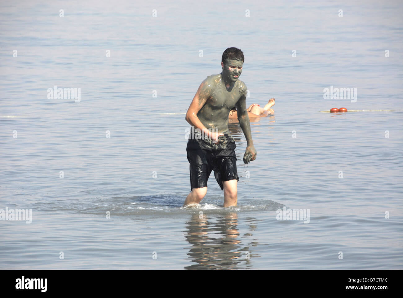 Healing mud taking in the Dead Sea, Israel Stock Photo - Alamy