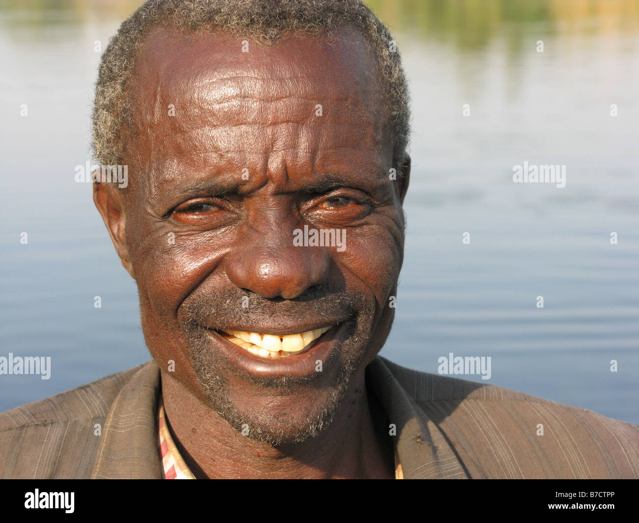 Portrait of smiling Bemba fisherman on Luapula river close to Mambilima Falls Democratic Republic of Congo Stock Photo