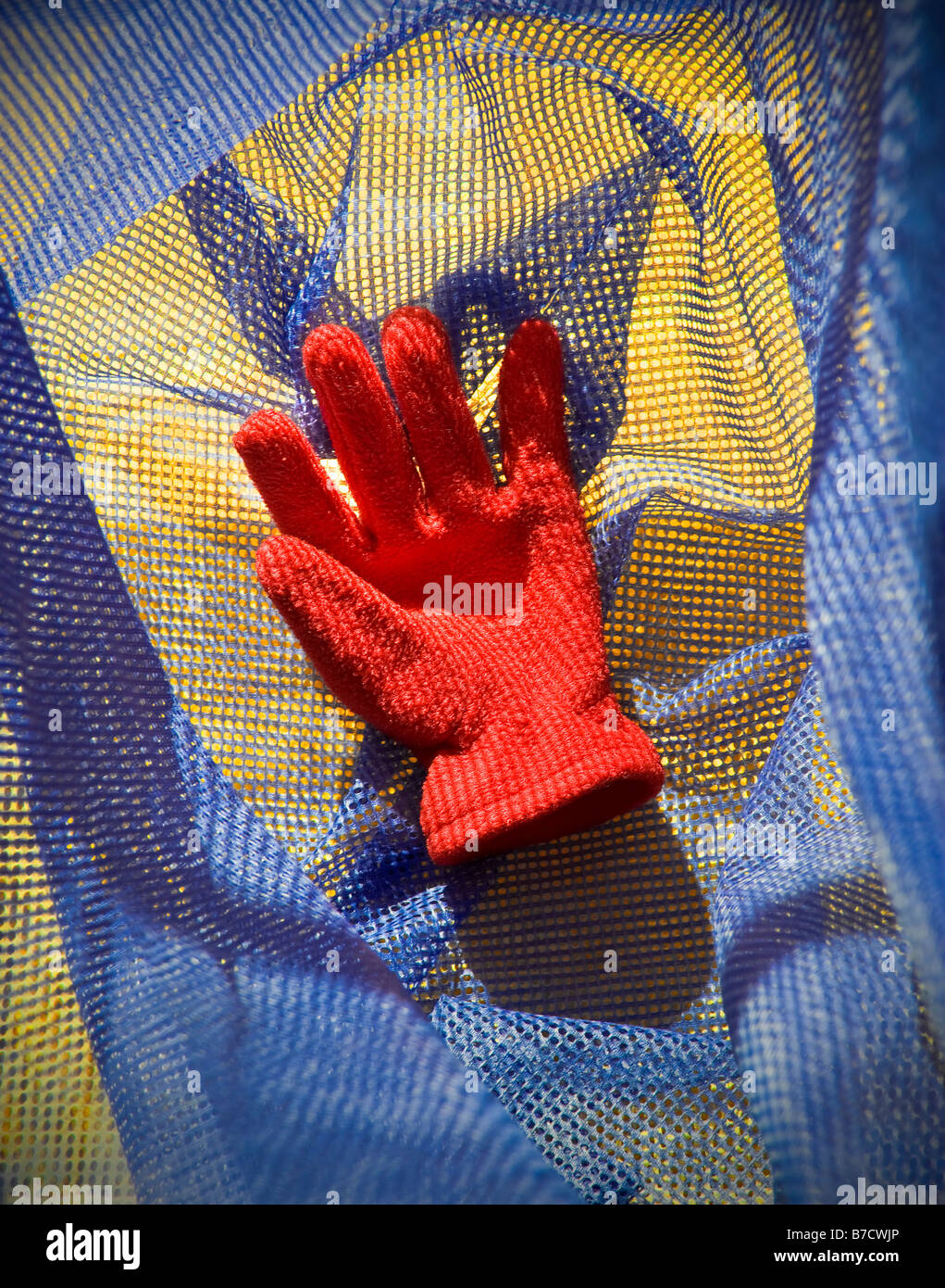 Red Glove Inside Mesh Laundry Bag Stock Photo