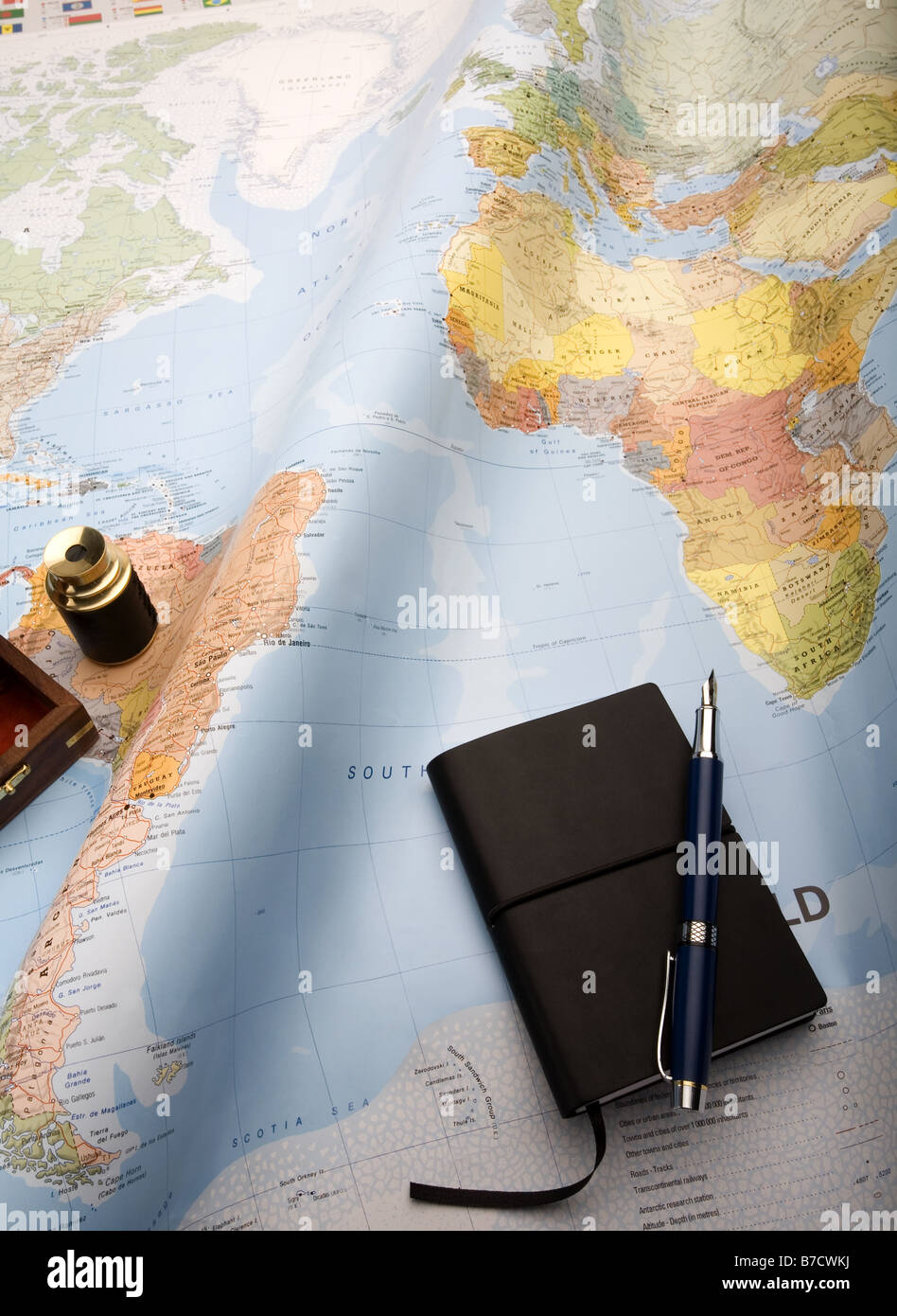 Map of the world showing the southern Atlantic with mini telescope and notebook Stock Photo