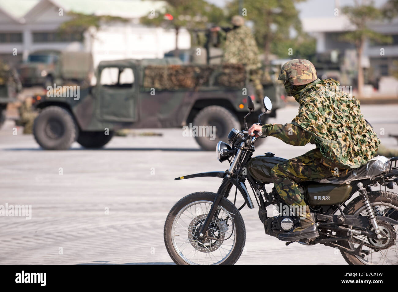Taiwanese Soldier Riding Motorcycle During War Exercises At The 58th Artillery Command, Taichung, Taiwan Stock Photo