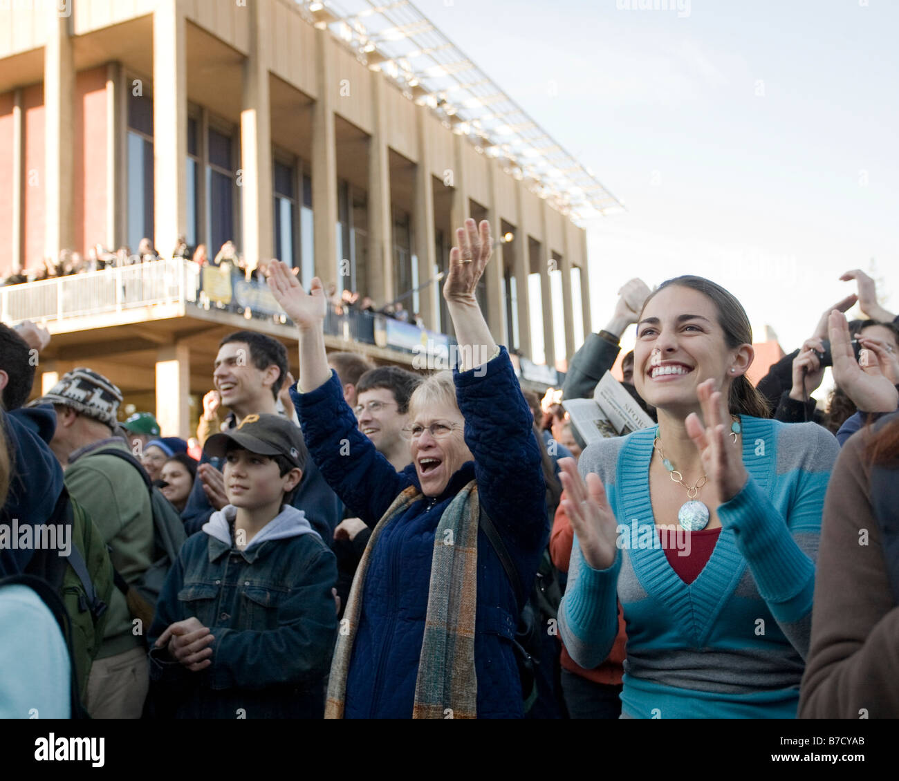 An emotional crowd celebrates the inauguration of Barack Obama at the University of California at Berkeley campus. Stock Photo