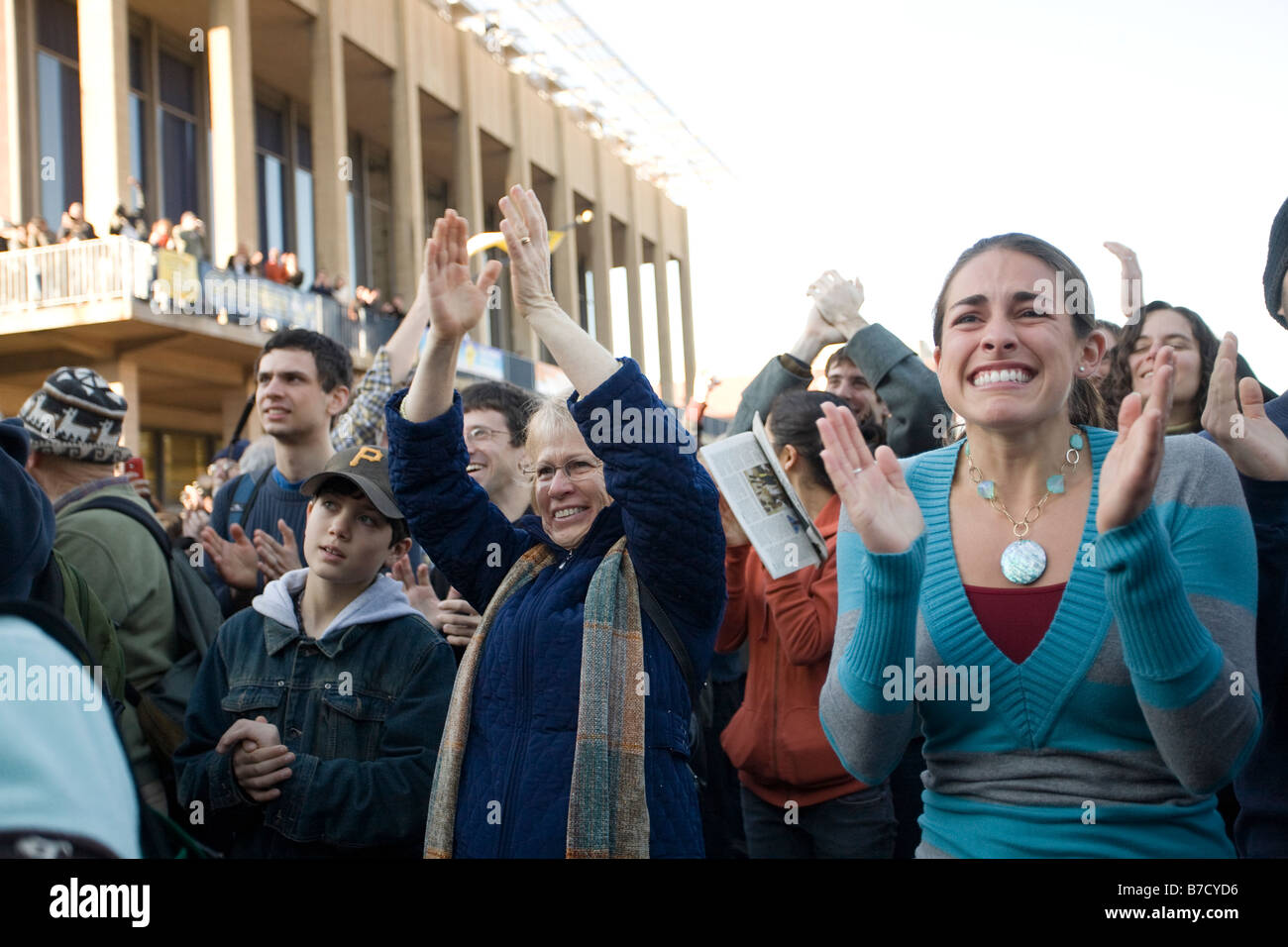 An emotional crowd celebrates the inauguration of Barack Obama at the University of California at Berkeley campus. Stock Photo