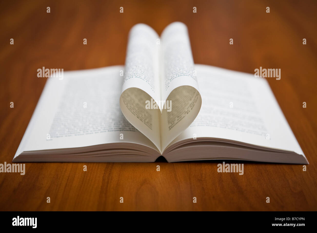 Pages of a book folded into a heart shape Stock Photo