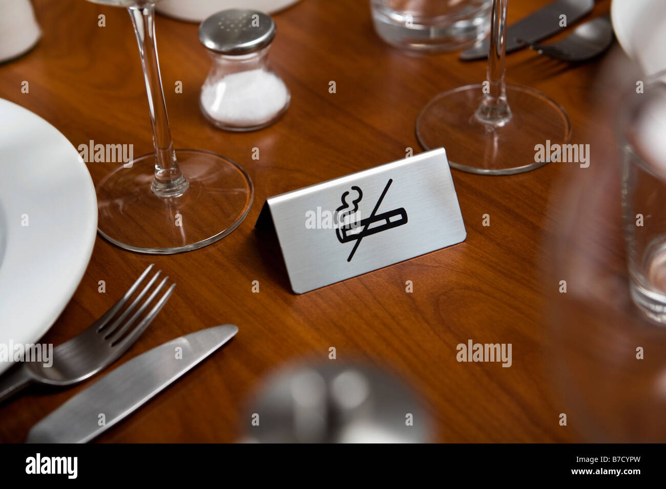 A No Smoking sign on a dining table Stock Photo