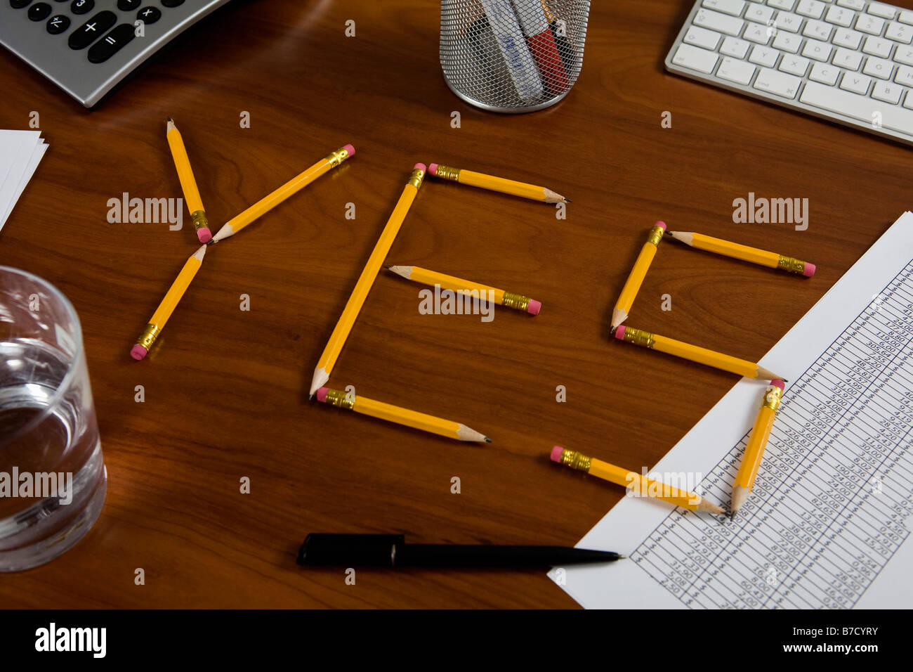 Pencils on a desk arranged to spell Yes Stock Photo Alamy