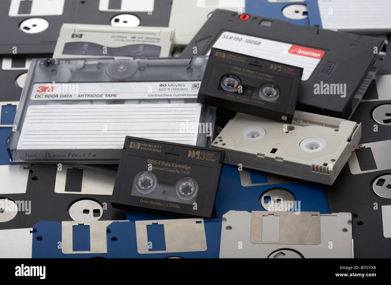 pile of old style mixed media tape cartridge dds dat tapes and