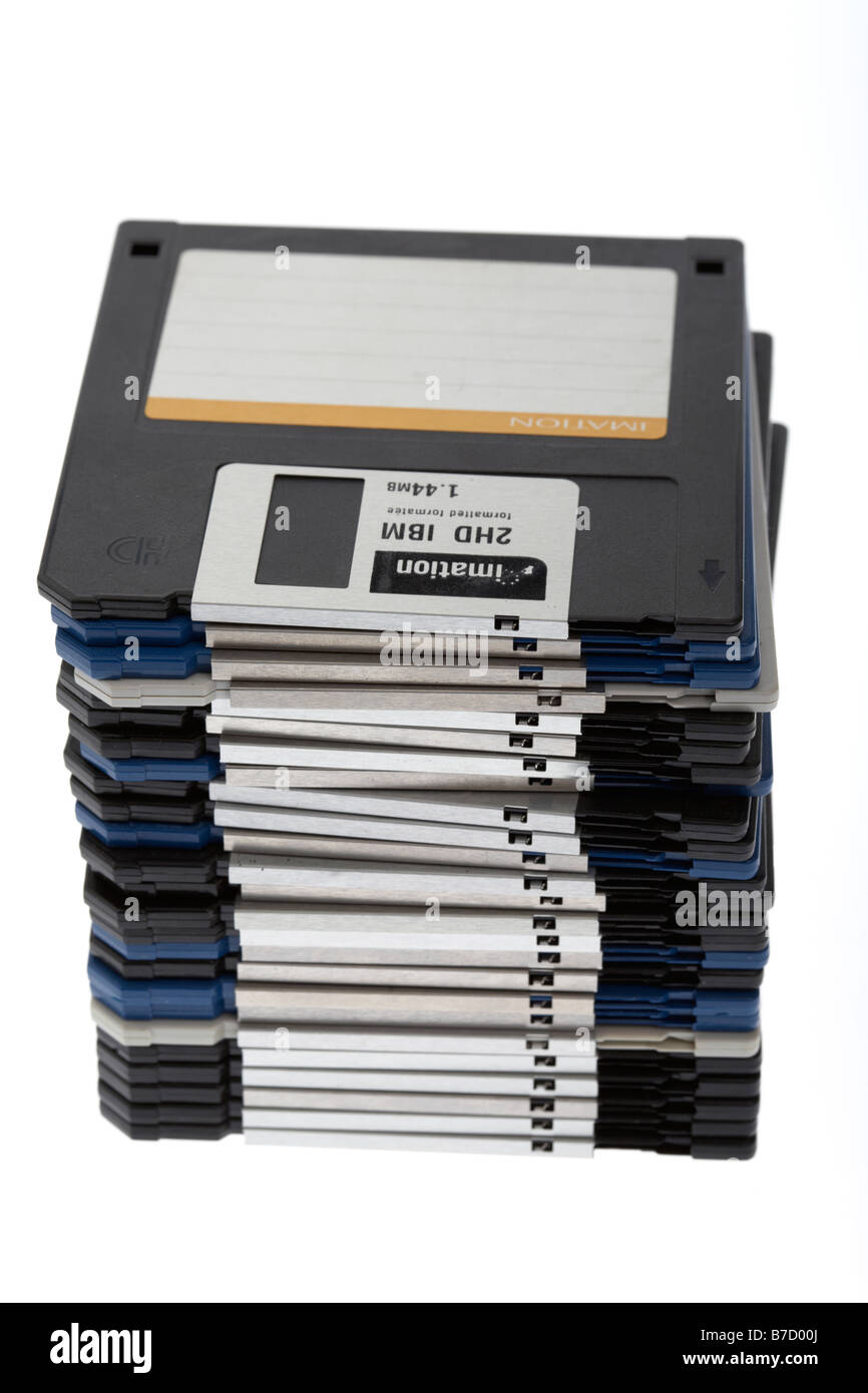 pile of old style floppy discs on a white background Stock Photo
