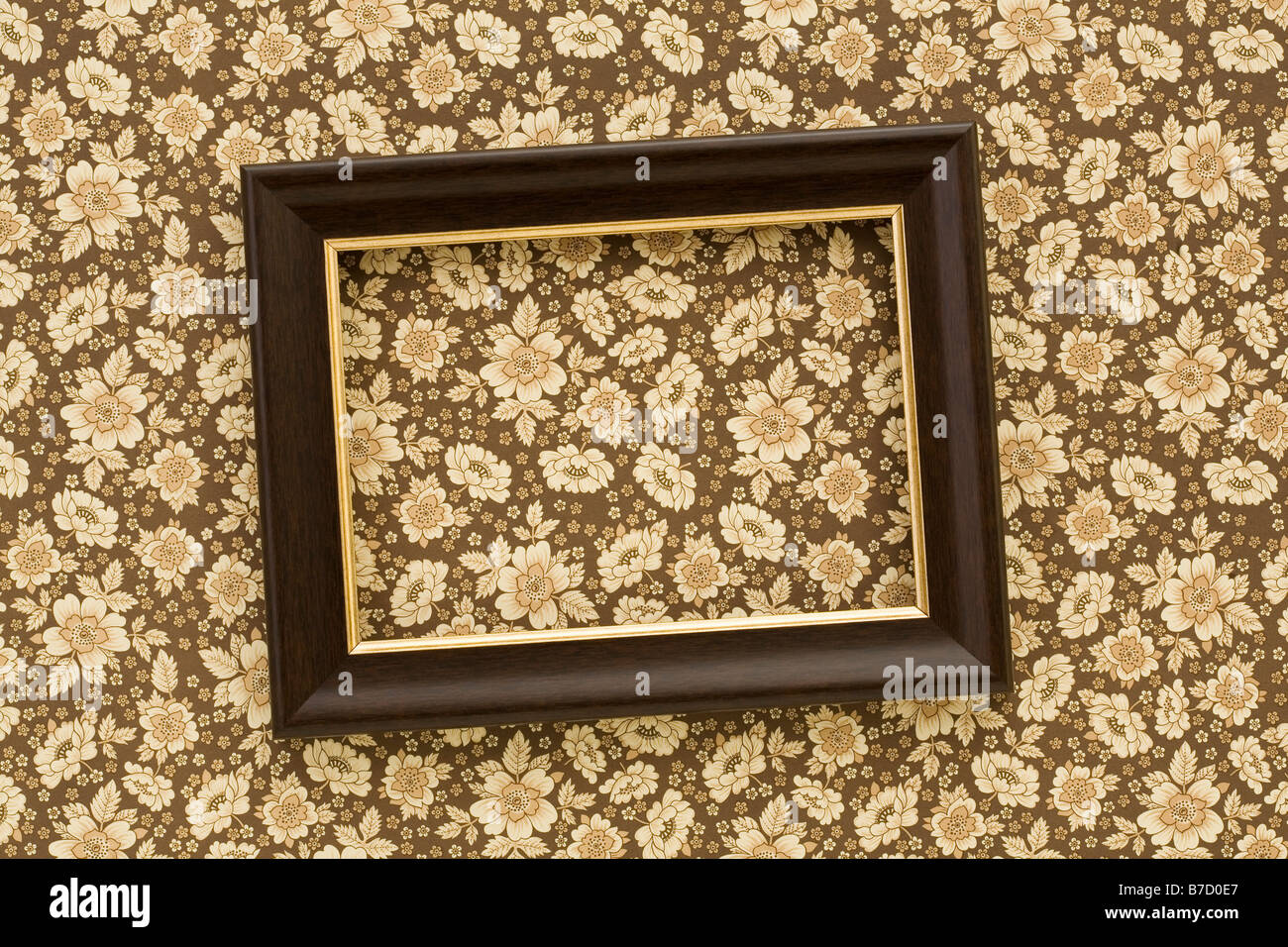 A slanted picture frame hanging on a wall Stock Photo