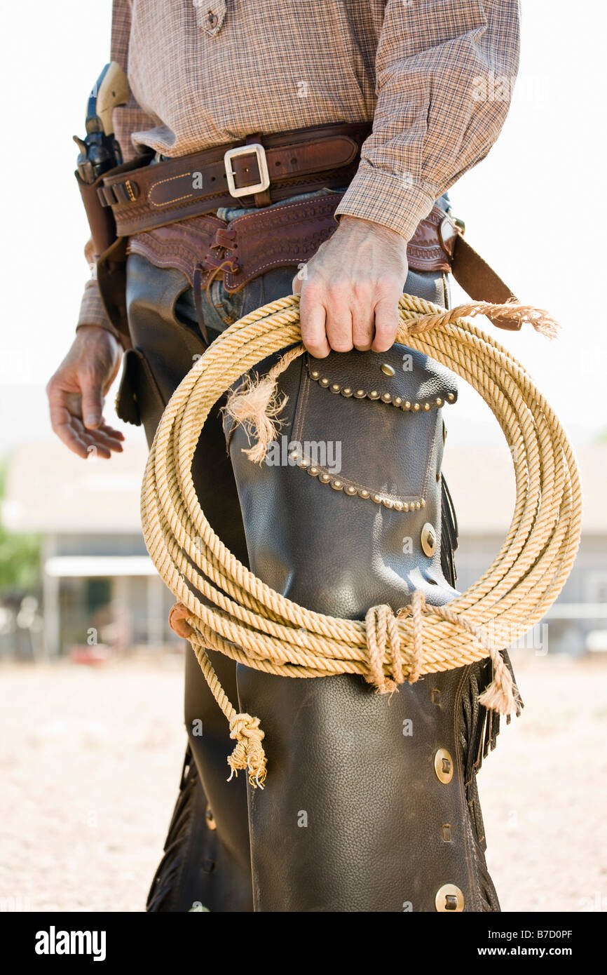 A cowboy holding a rope Stock Photo