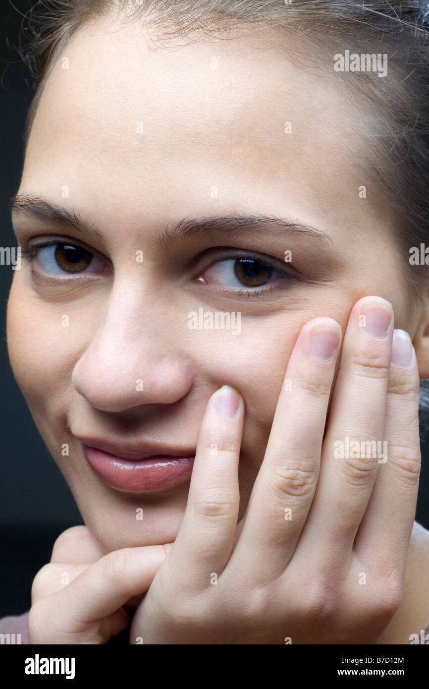 Portrait of a smiling young woman Stock Photo