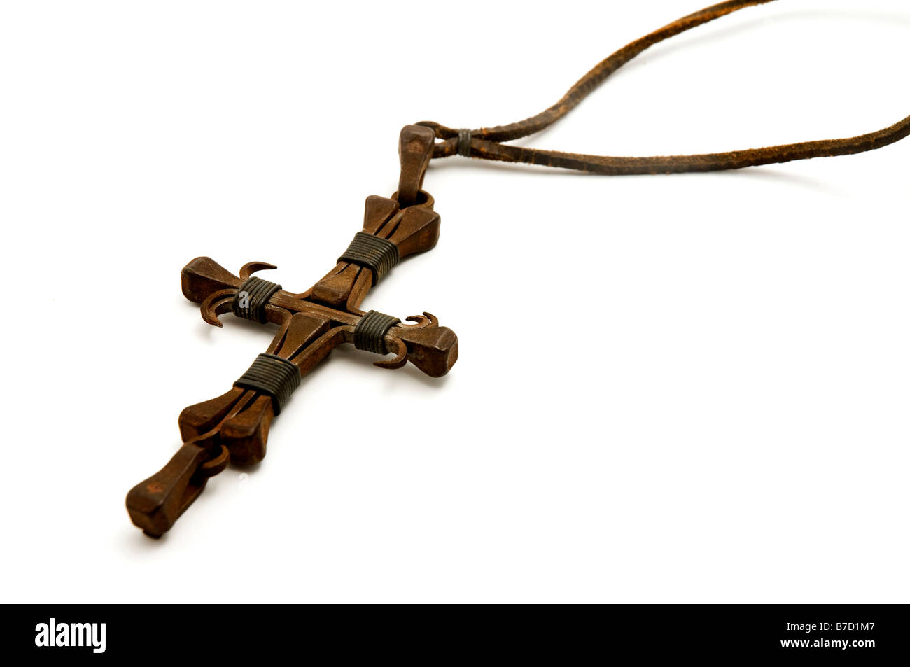 Old iron cross made from nails on a white background Stock Photo