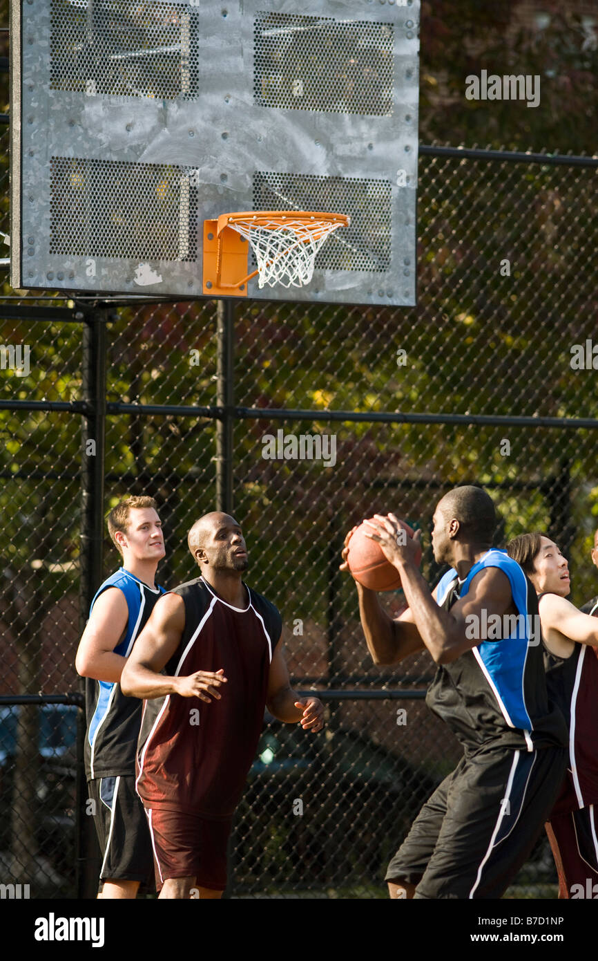 Four men playing basketball Stock Photo Alamy