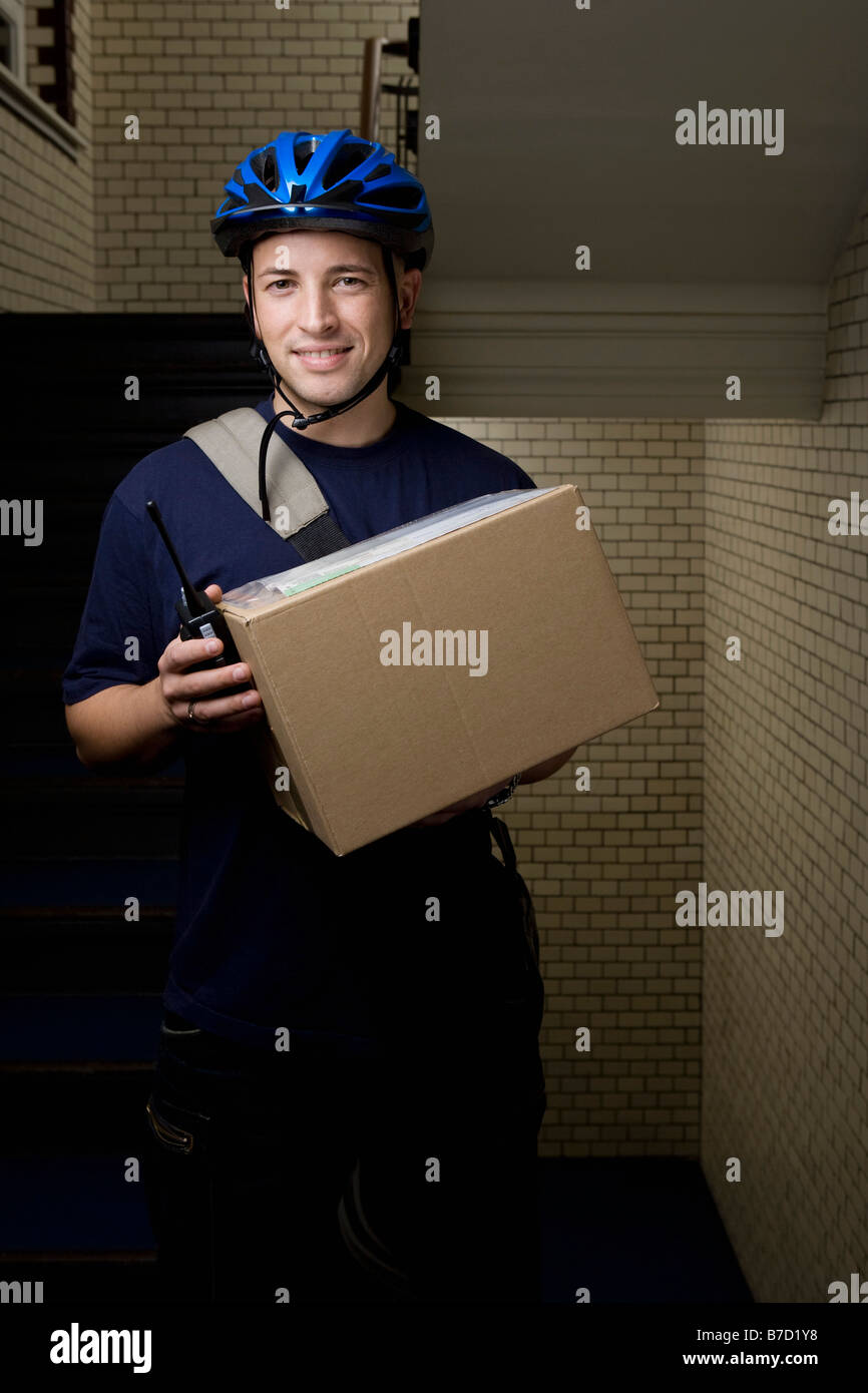 A bicycle messenger delivering a package Stock Photo Alamy