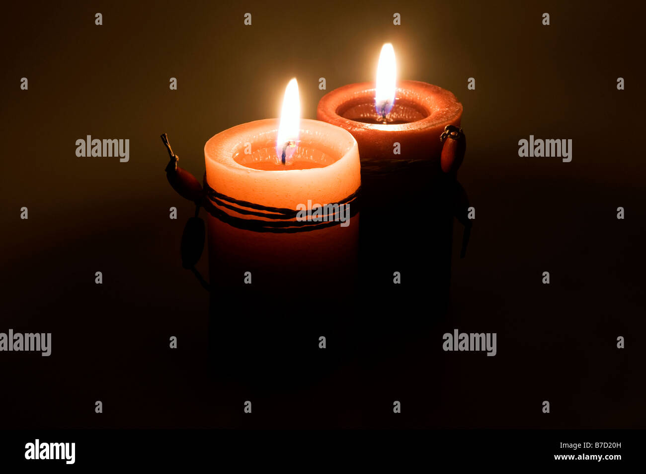 Red candles on a dark background Stock Photo