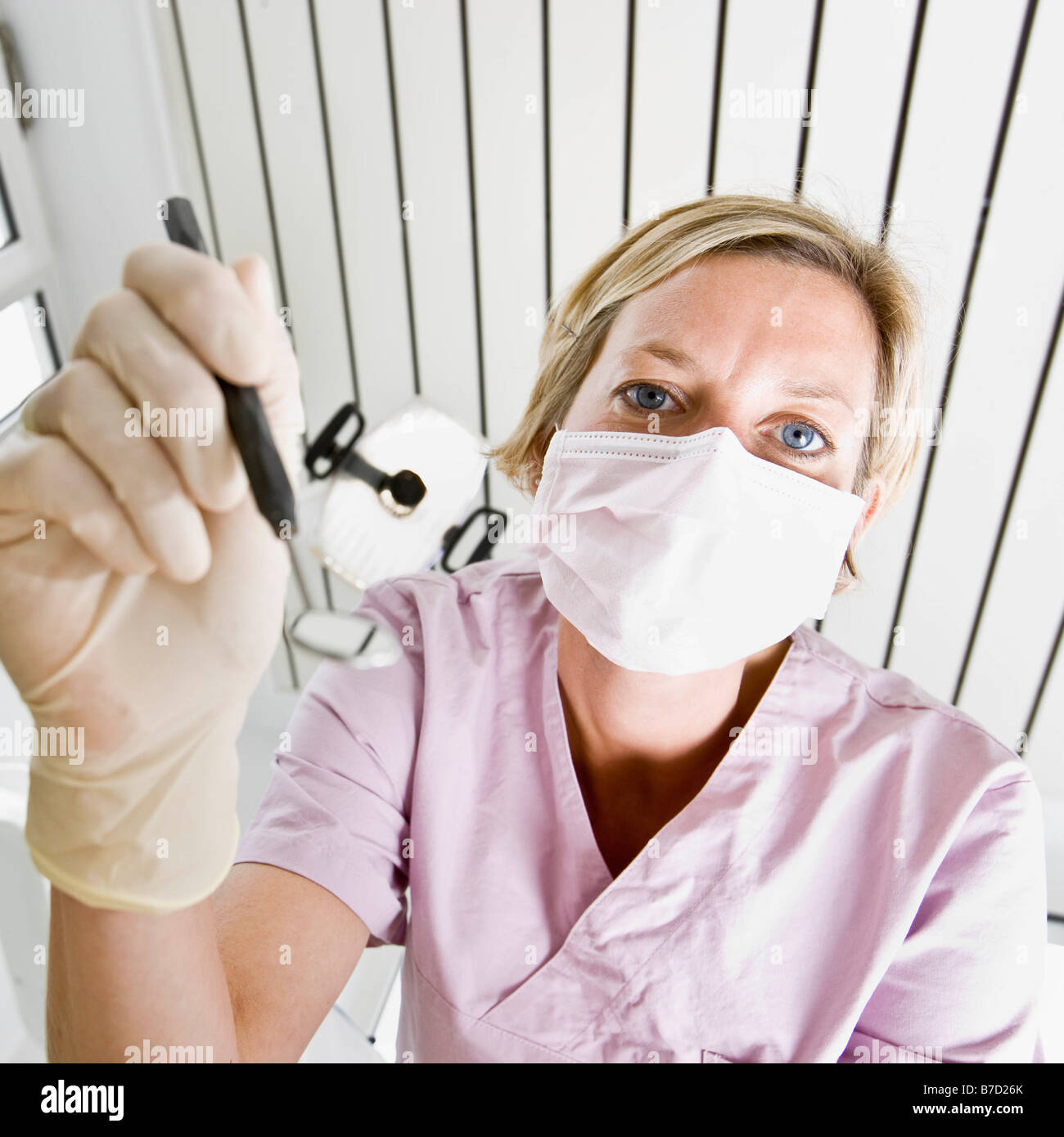 Dental assistant using tools Stock Photo Alamy