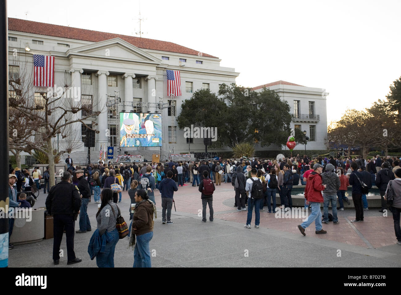 The inaugural watching crowd in front of the Sproul Hall Jumbotron at the University of California at Berkeley. Stock Photo