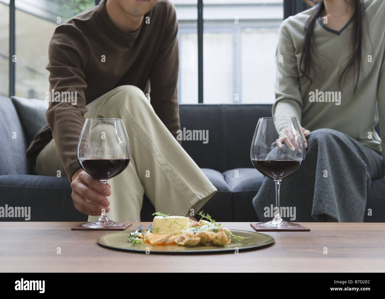 Couple drinking red wine Stock Photo - Alamy