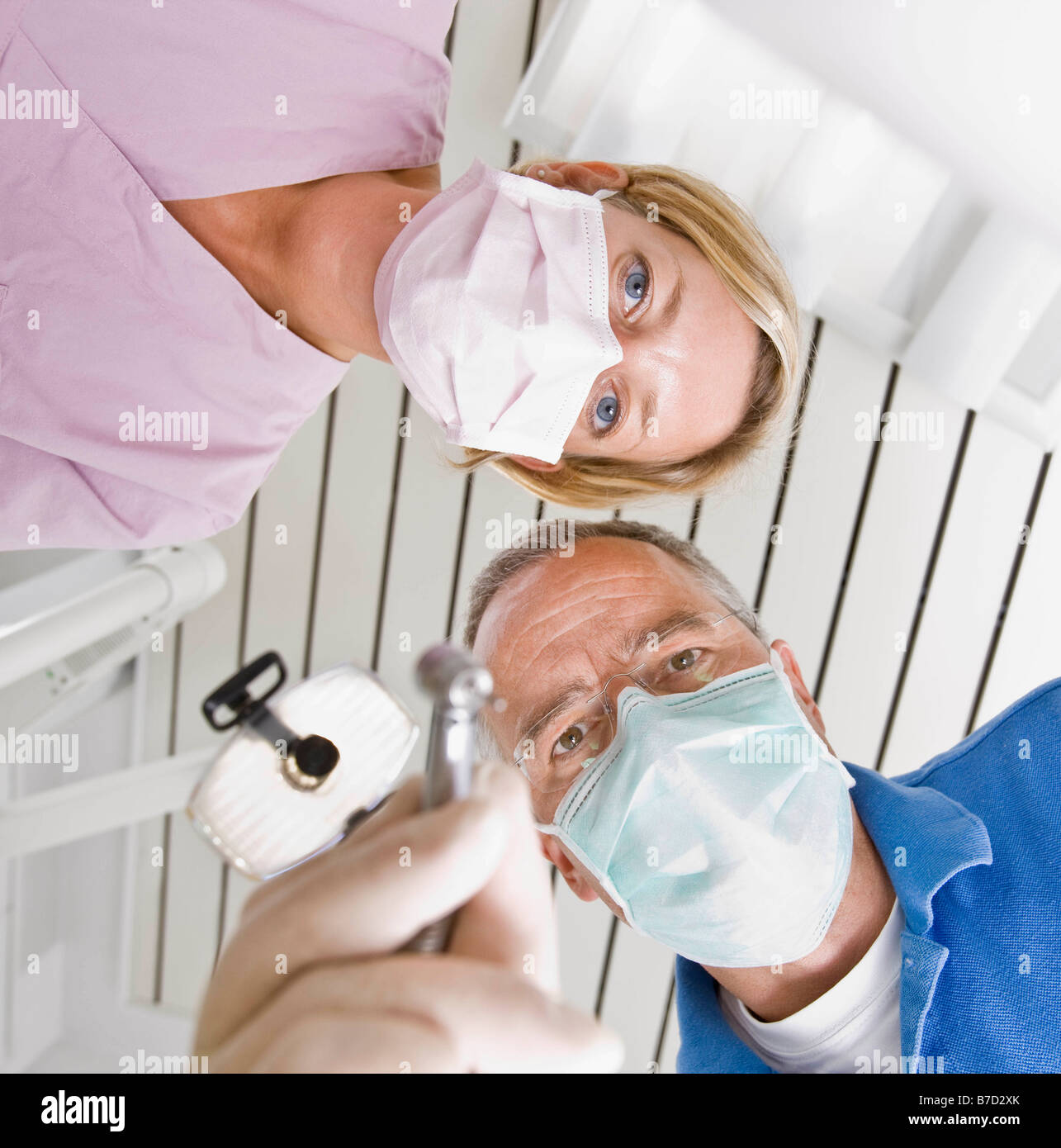 Dentist and assistant using tools Stock Photo Alamy