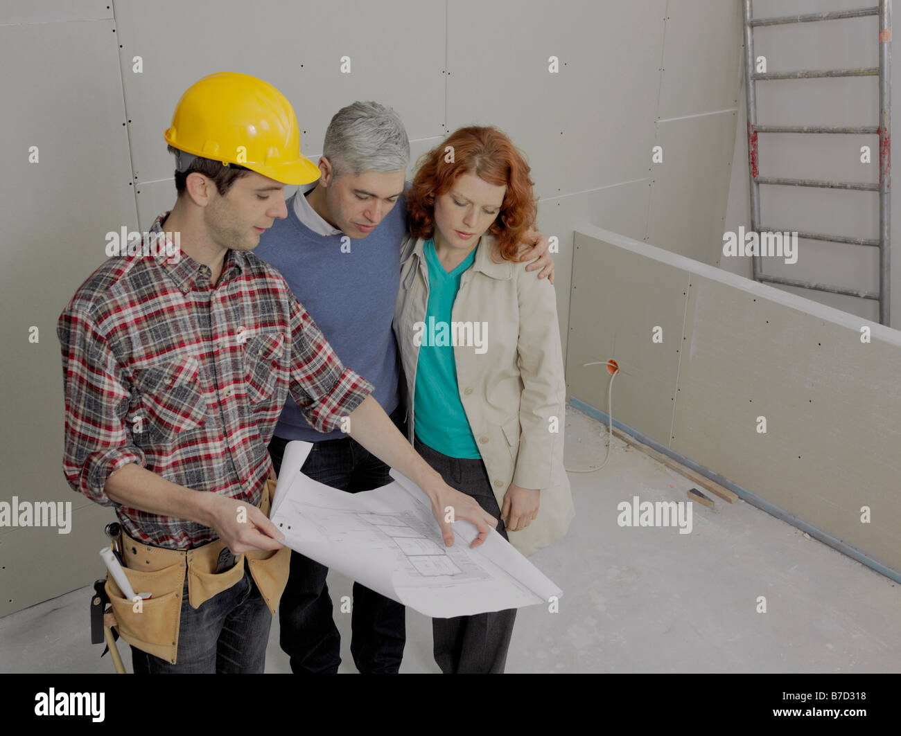 Worker going over blueprints hi-res stock photography and images - Alamy