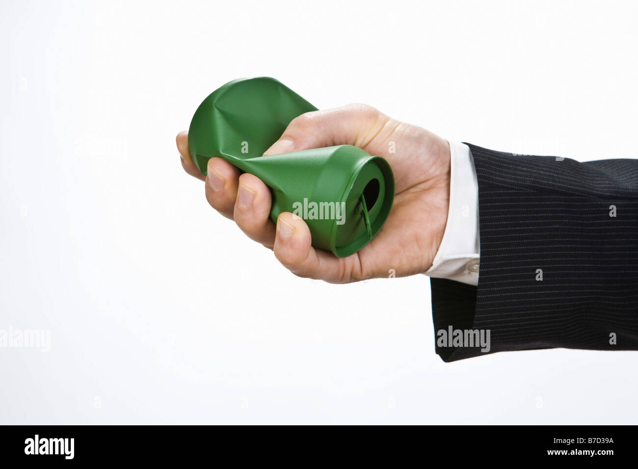 A hand crushing a silver can Stock Photo Alamy