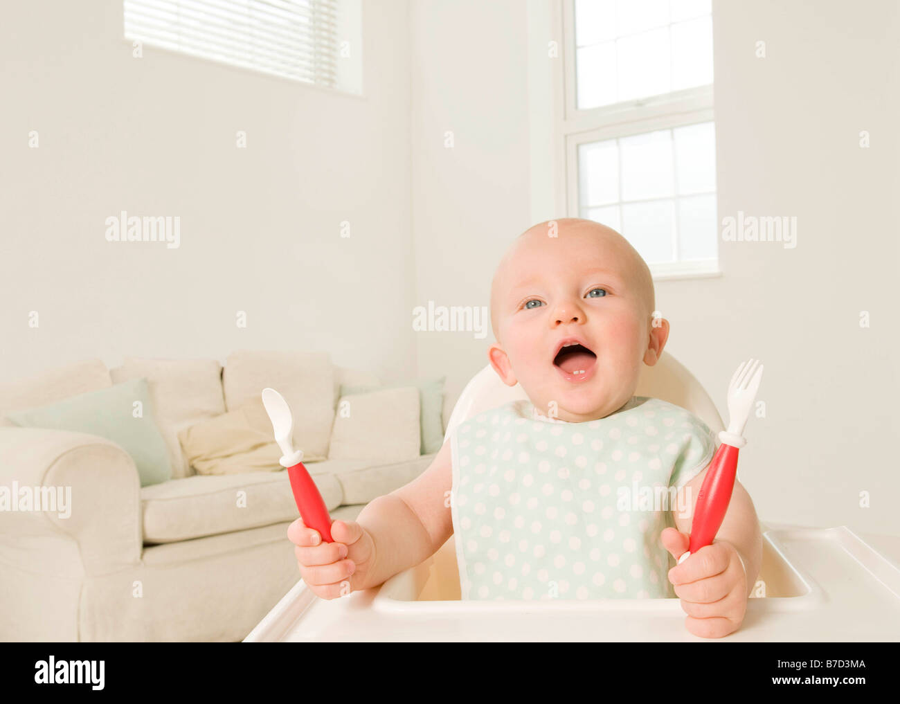 A portrait of a baby demanding food. Stock Photo