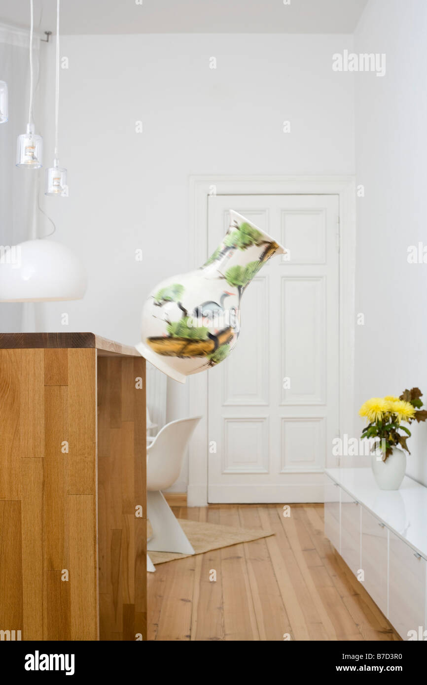 A vase falling from a counter Stock Photo Alamy