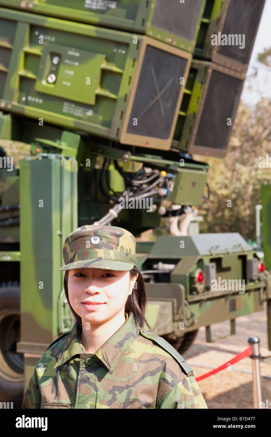 Portrait Of A Taiwanese Female Soldier Standing Next To A Tien Kung SAM, Sky Bow 1, Missile Launcher, Taiwan Stock Photo