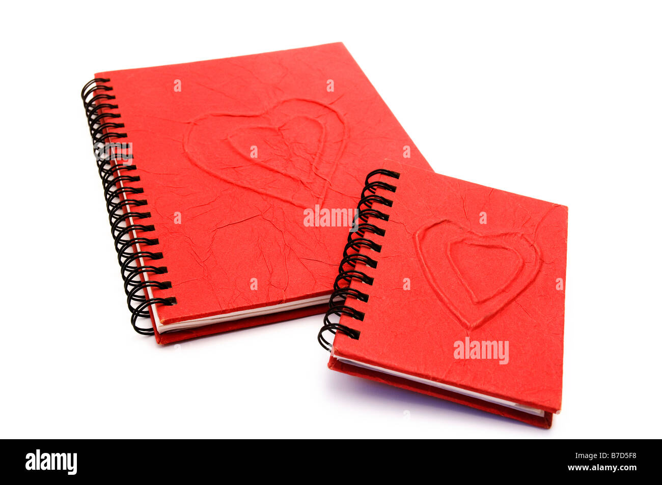 Red diary with hearts on a white background Stock Photo