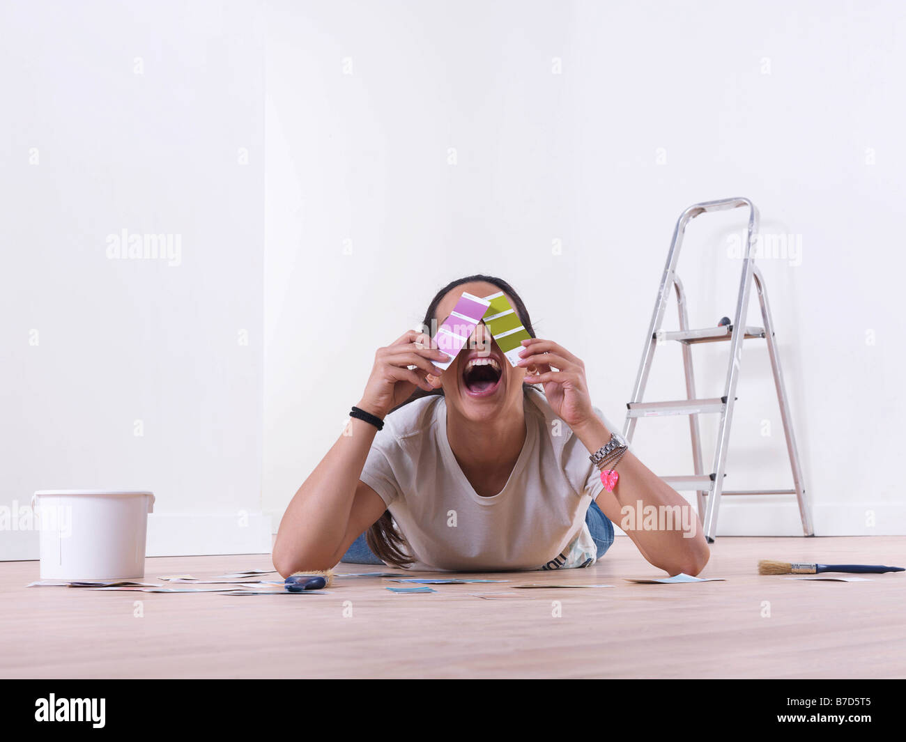 Girl choosing paint colours Stock Photo