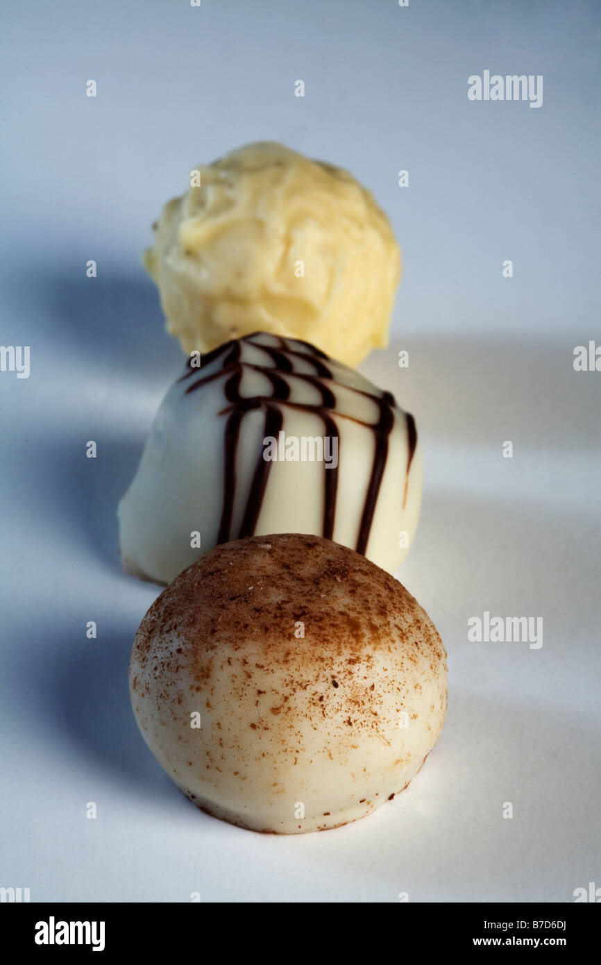 three luxury chocolates lined up confectionary Stock Photo
