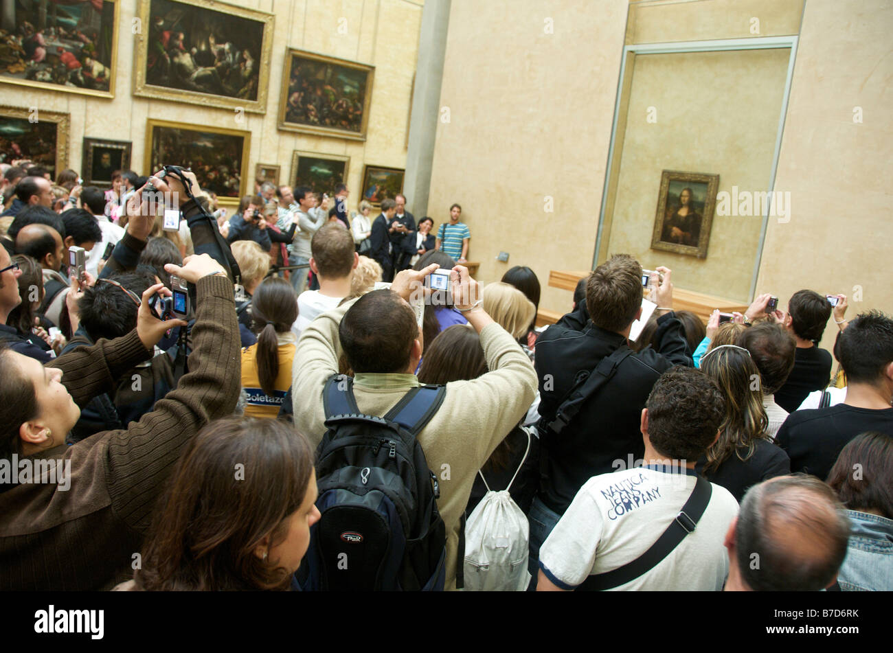 Mona Lisa Crowd of tourists taking pictures of the painting in the