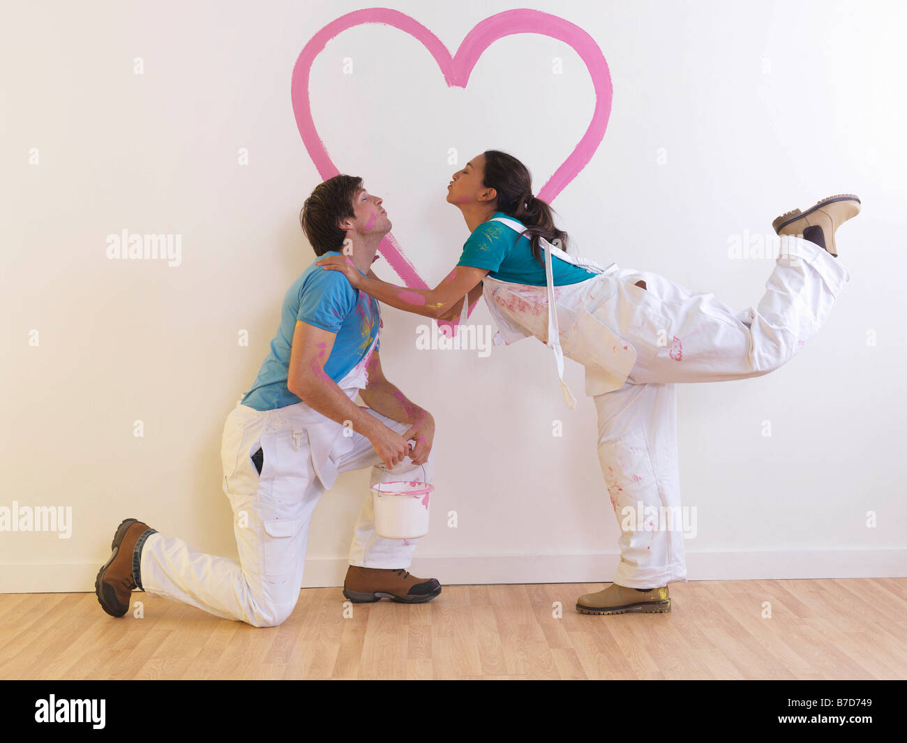 Couple with heart painting. Stock Photo
