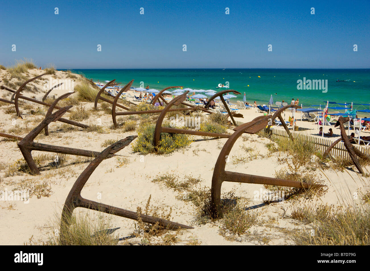 Eastern Algarve (the Sotavento), Old Anchors On The Dunes On The Praia Do Barril, Near Tavira Stock Photo