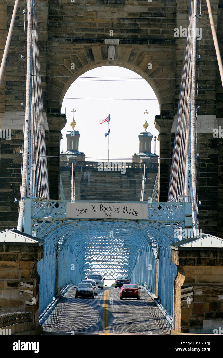 Cars cross the historic John A Roebling Bridge over the Ohio River from