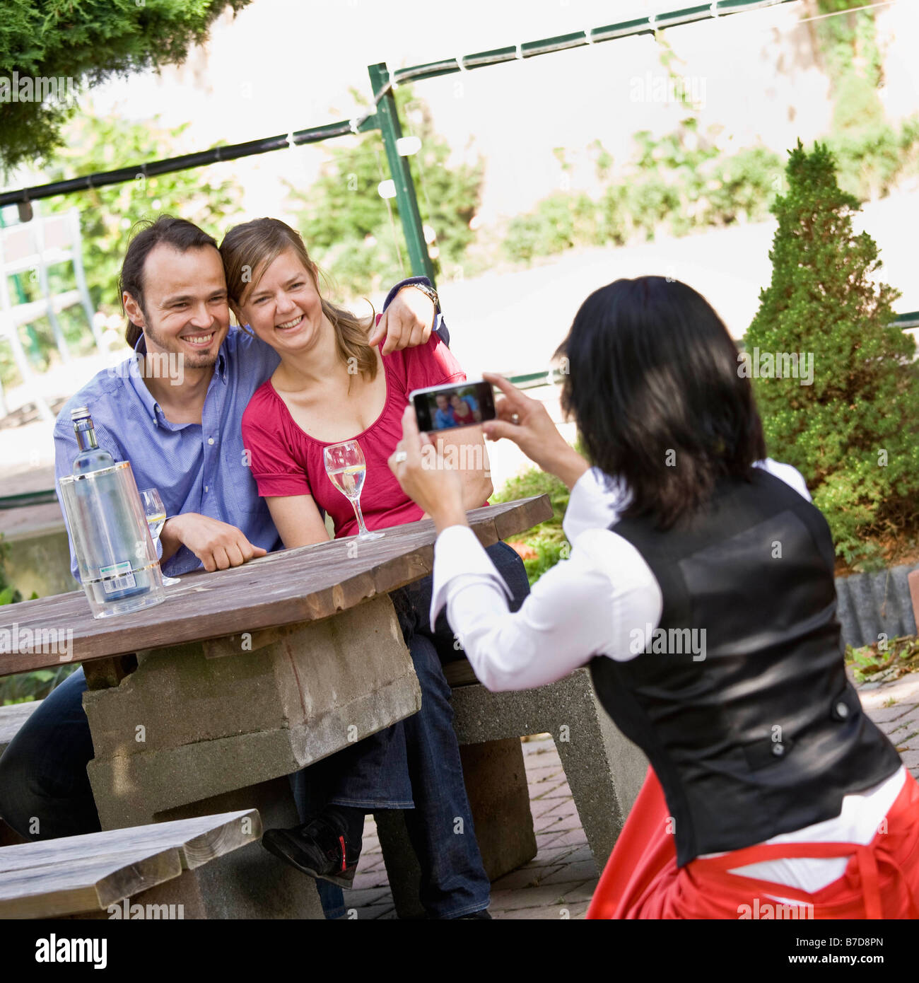 Man and woman posing for a photo Stock Photo - Alamy