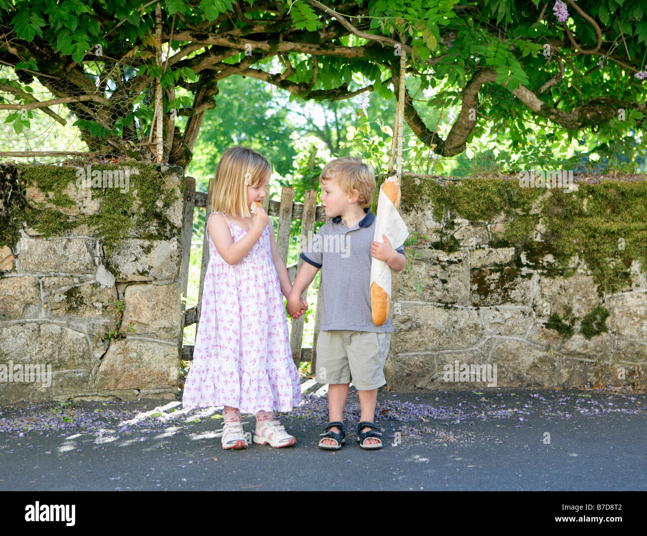 Young girl and boy holding hands Stock Photo - Alamy