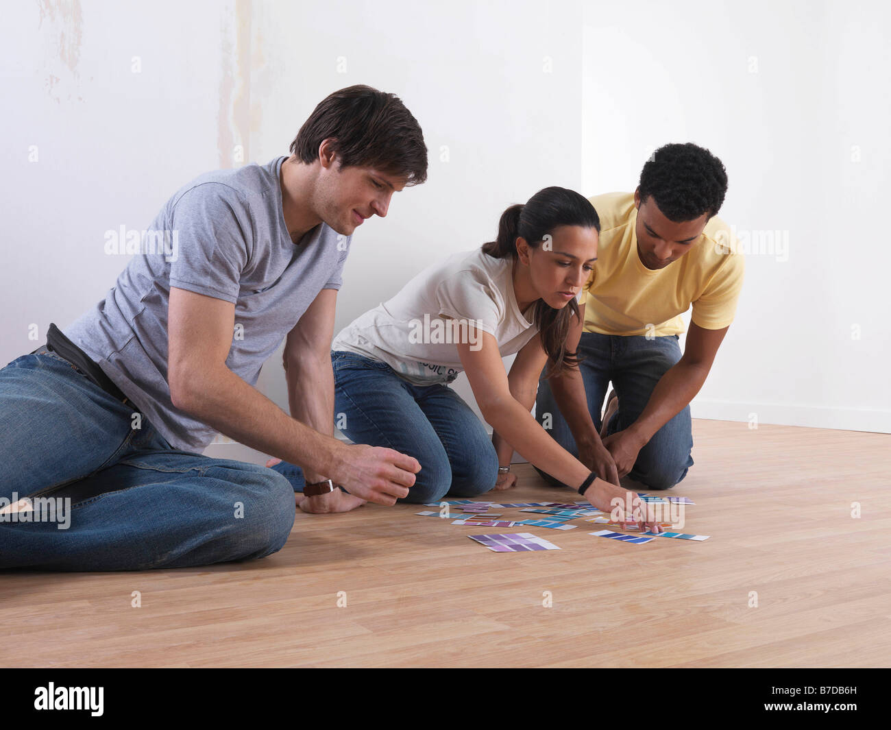 Group of friends choosing paint colours Stock Photo Alamy