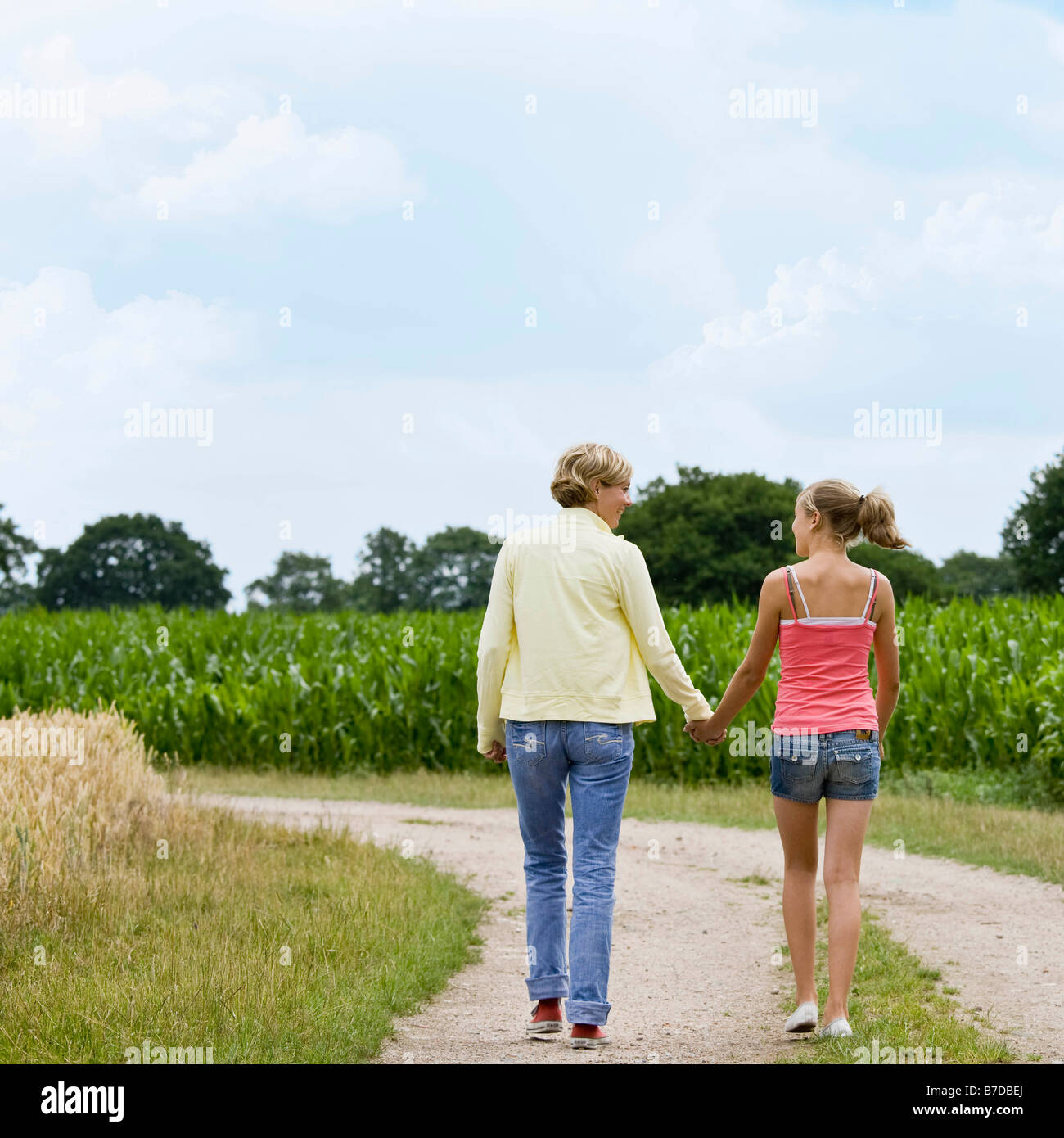 Woman and girl taking a walk Stock Photo - Alamy