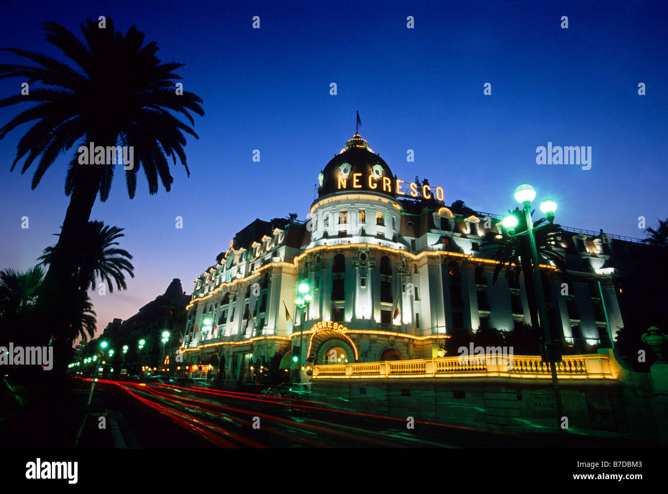 The Negresco Palace hotel lit at night on the Promenade des Anglais Stock Photo